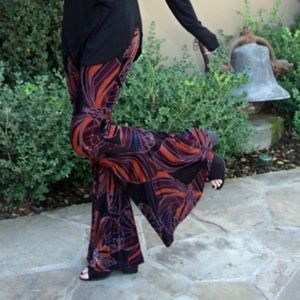 Worm once. Free People float on velvet butterfly print pull on pant